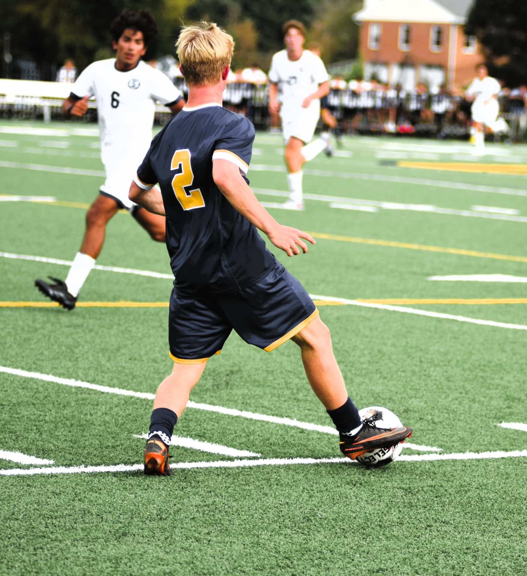 St. Paul's number 2 plays the ball upfield