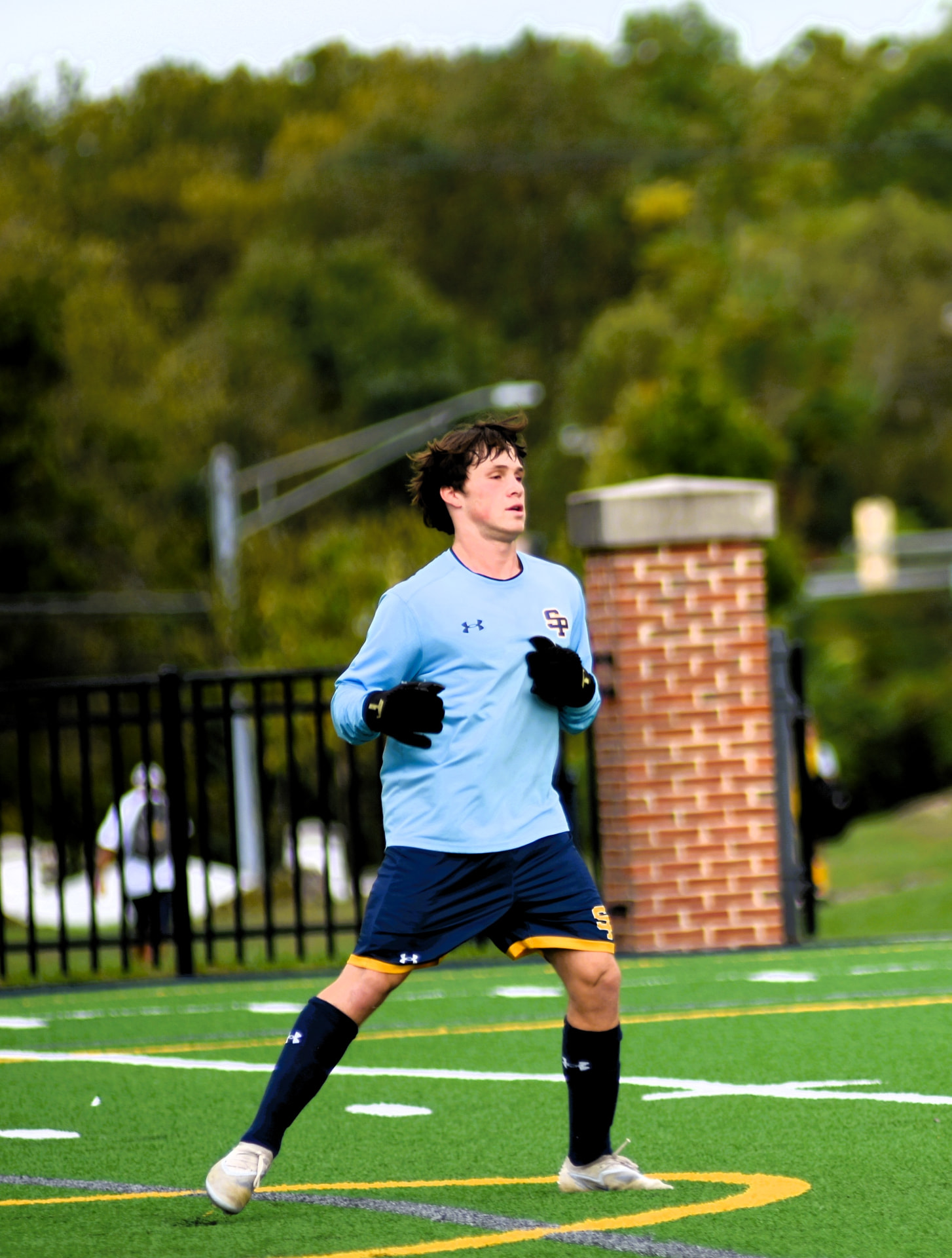 St. Paul's goalkeeper warms up on the field