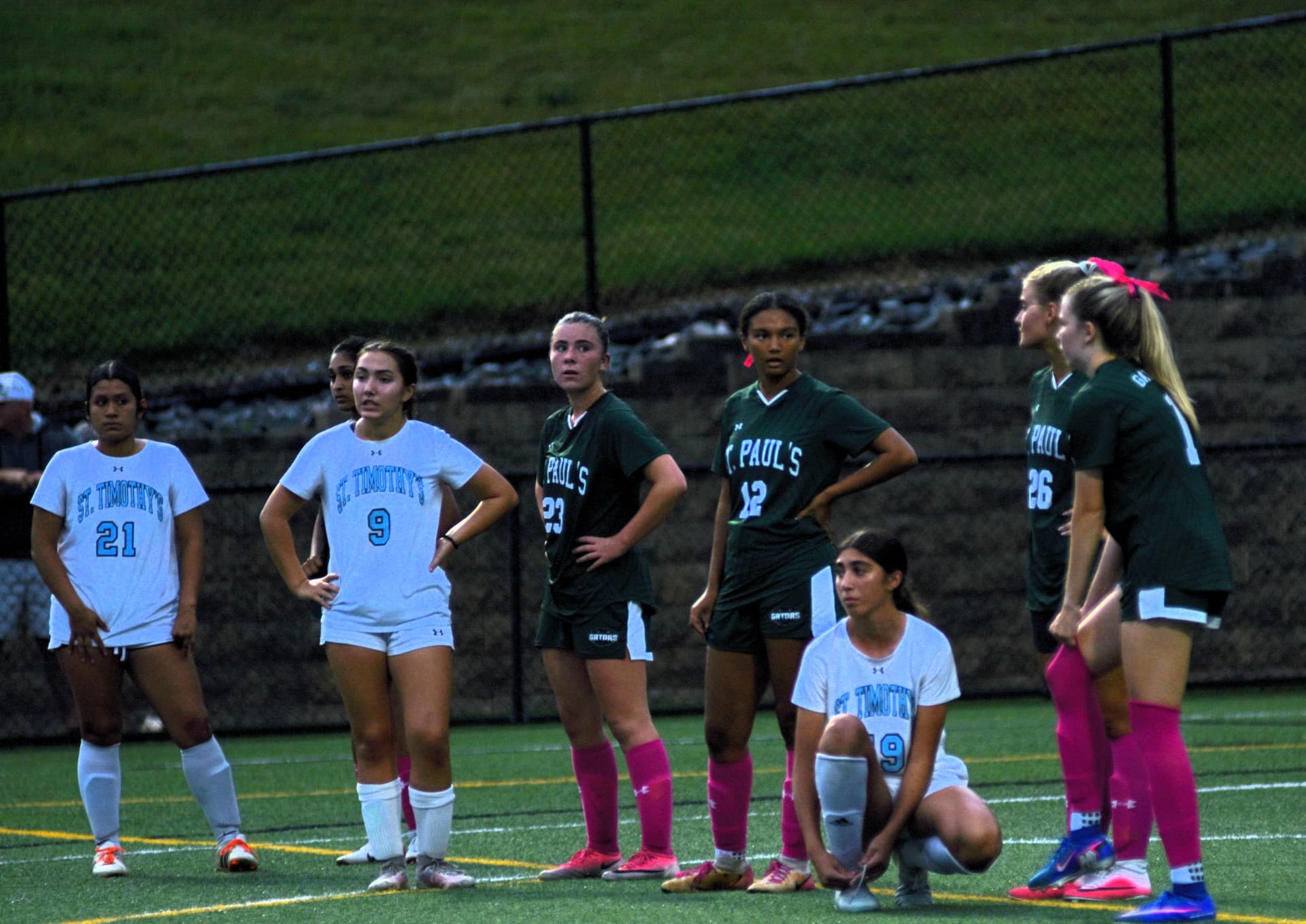 Gators and St. Timothy's players line up for a set piece