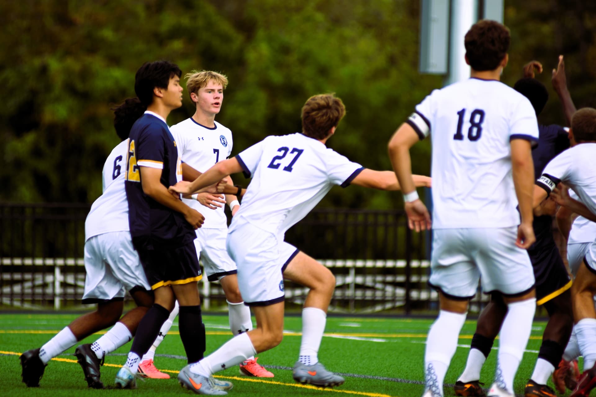 Players jostle for position on a set piece