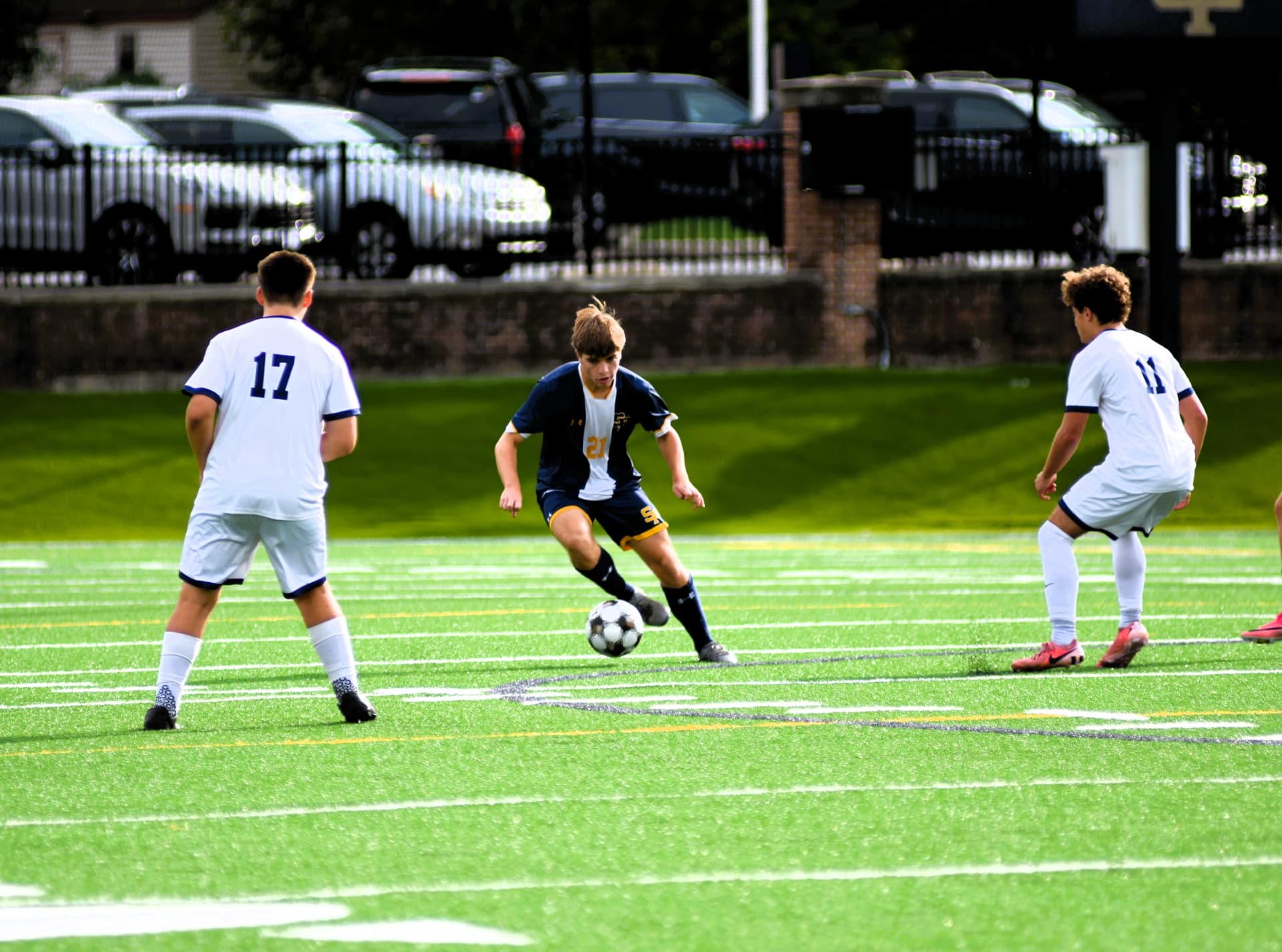 St. Paul's number 21 cuts past two defenders