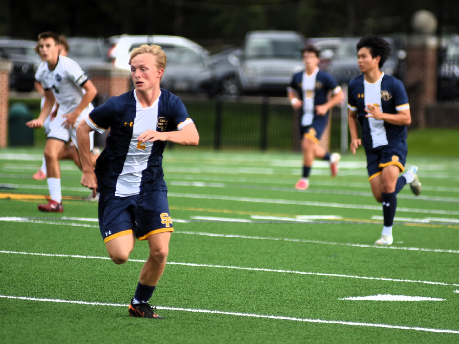 St. Paul's number 2 sprints downfield