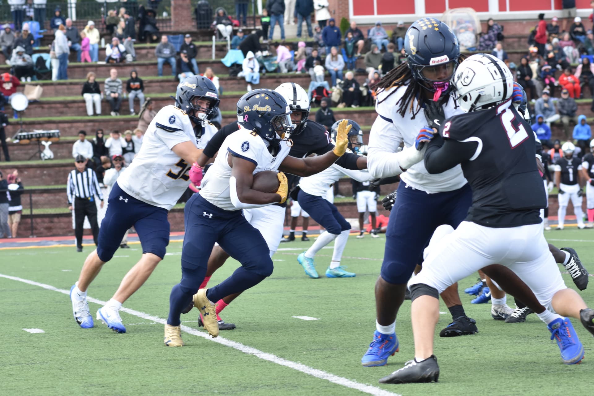 The Crusaders drive forward against Curley near the goal line