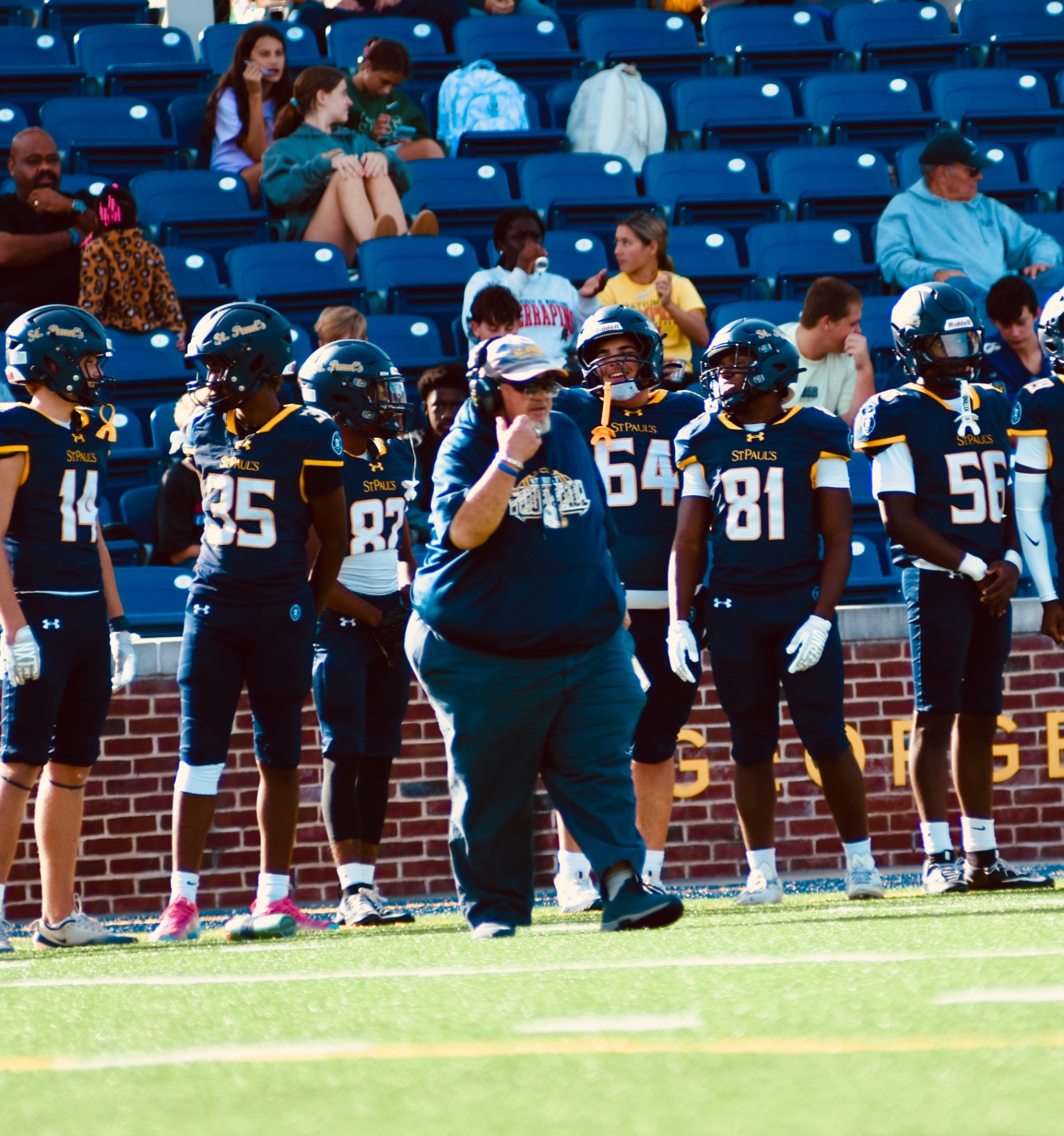Coach and players on the sideline